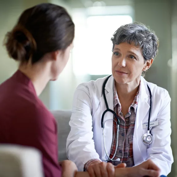 Médica com paciente